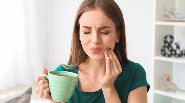 Lady Having A Pain In Her Teeth